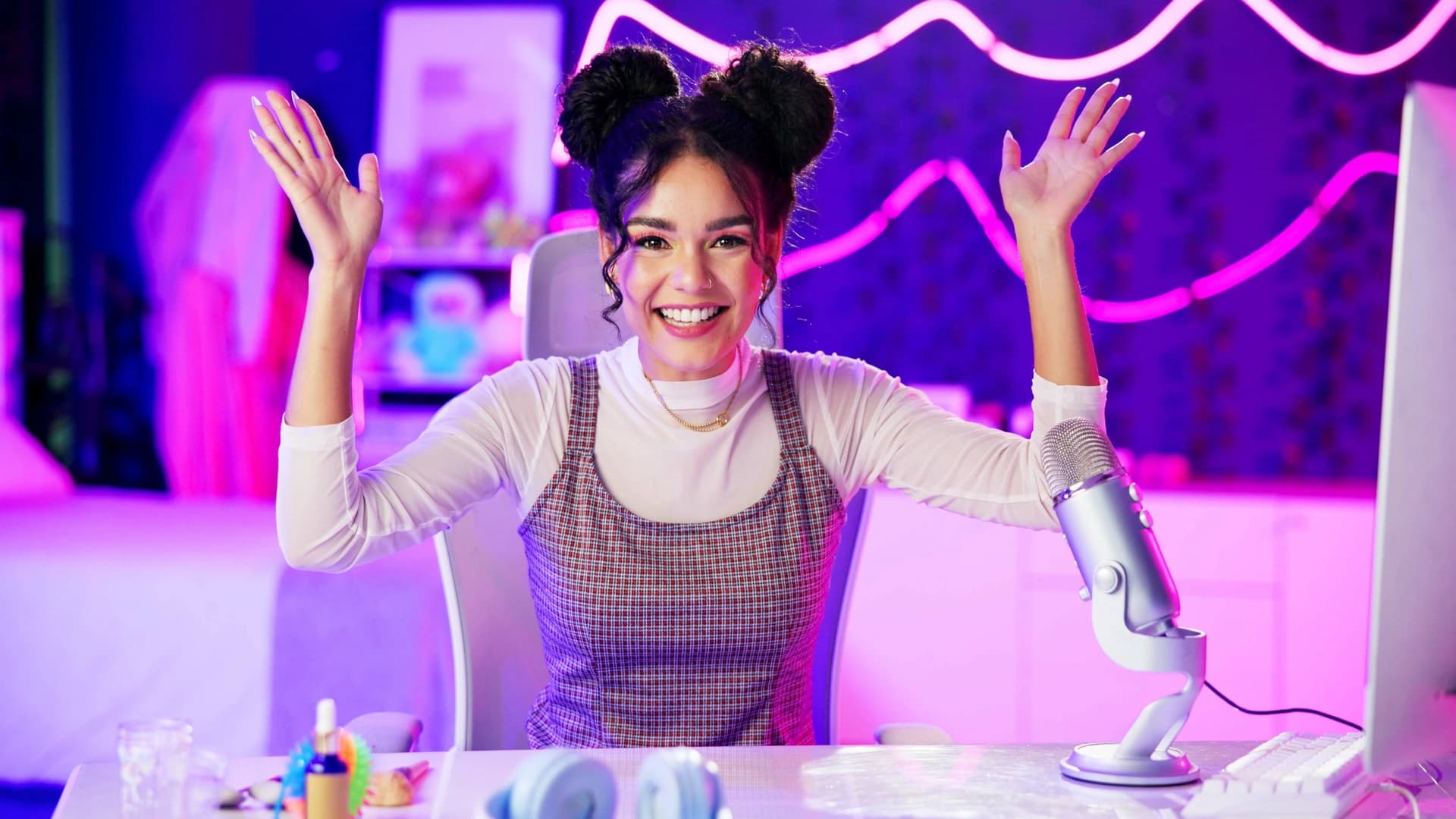 Creator on camera with a microphone and ring light